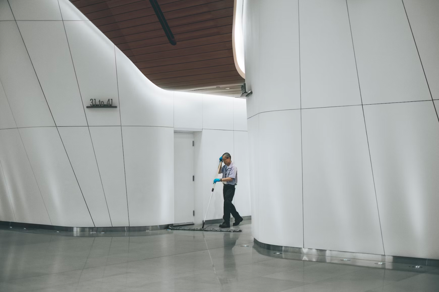 A janitorial staff member works in a commercial building.